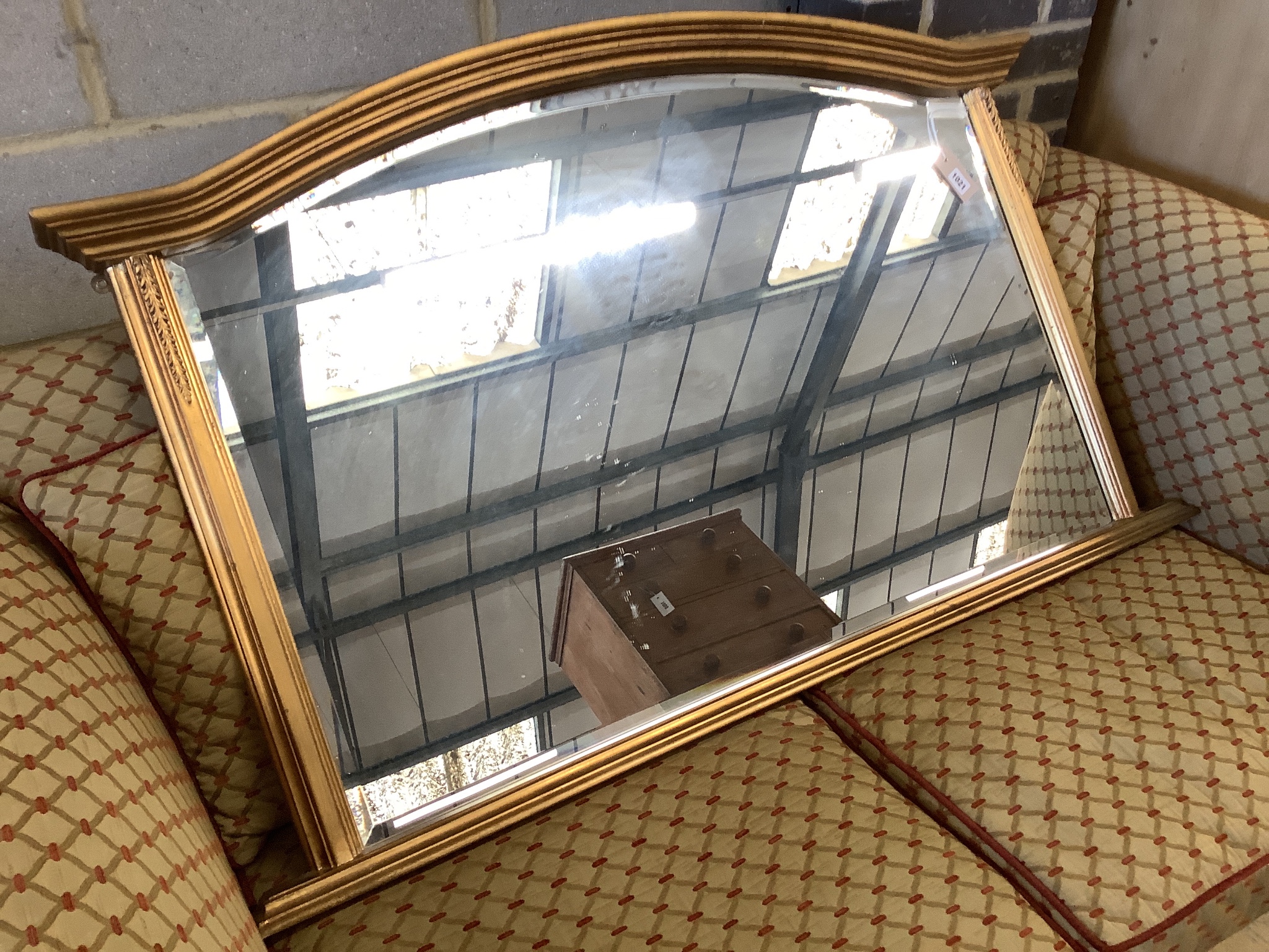 A reproduction gilt overmantel mirror, width 122cm, height 77cm